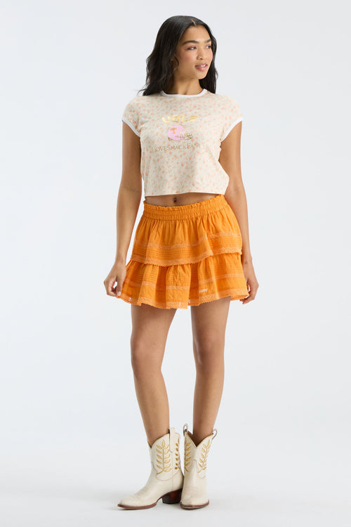 Bright orange tiered ruffle mini skirt with elastic waistband, knee-length coverage