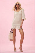 Ivory crochet mini dress with scalloped hem and lace-like eyelet edging