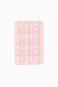 Pink floral wireless portable charger with repeating rose-pattern print