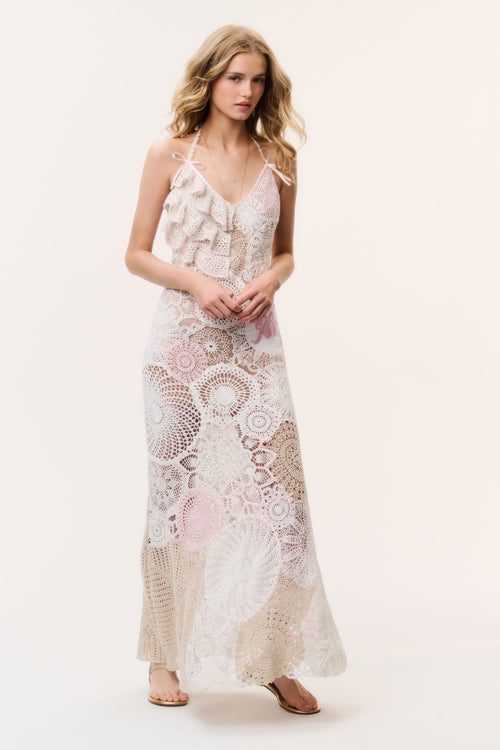 Patchwork crochet maxi dress in pale pink with thin straps and layered ruffle bodice.