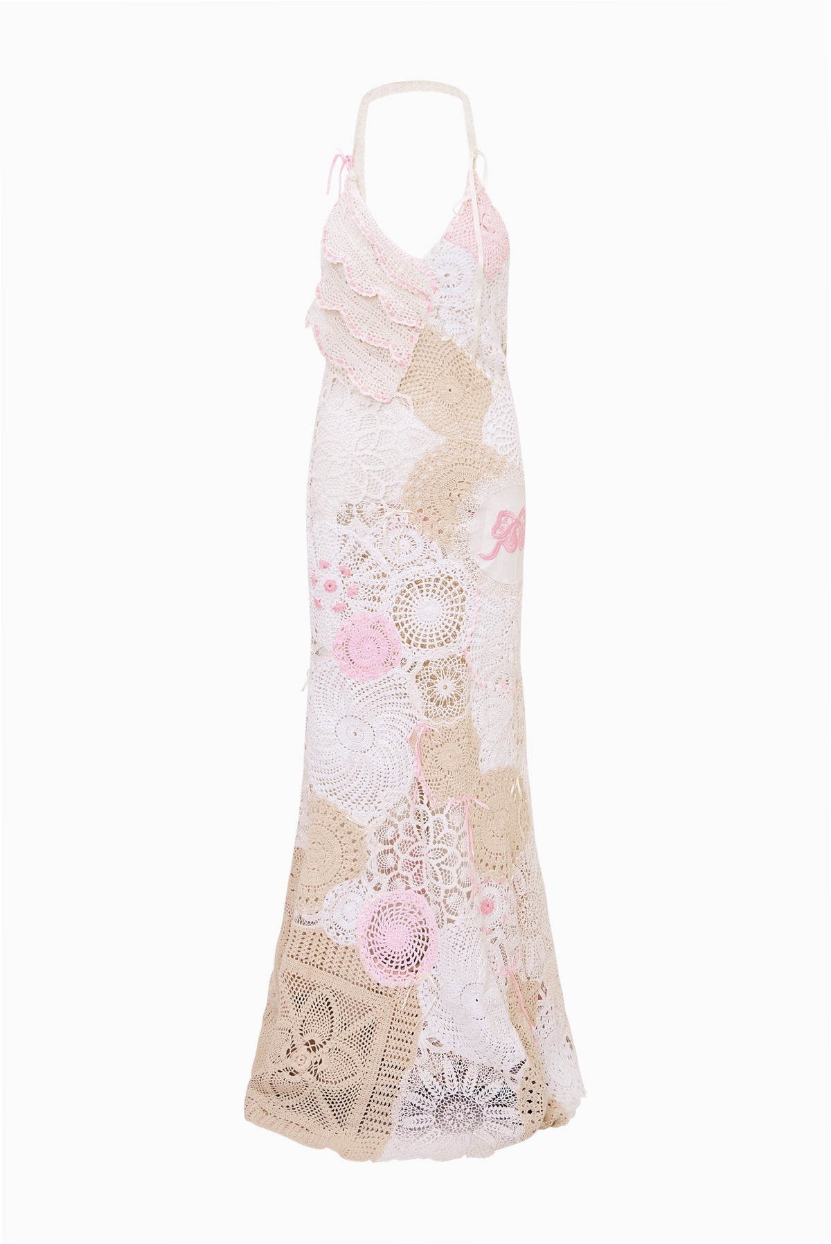Pale pink patchwork crochet maxi dress on hanger, sleeveless with V-neck and ruffles.