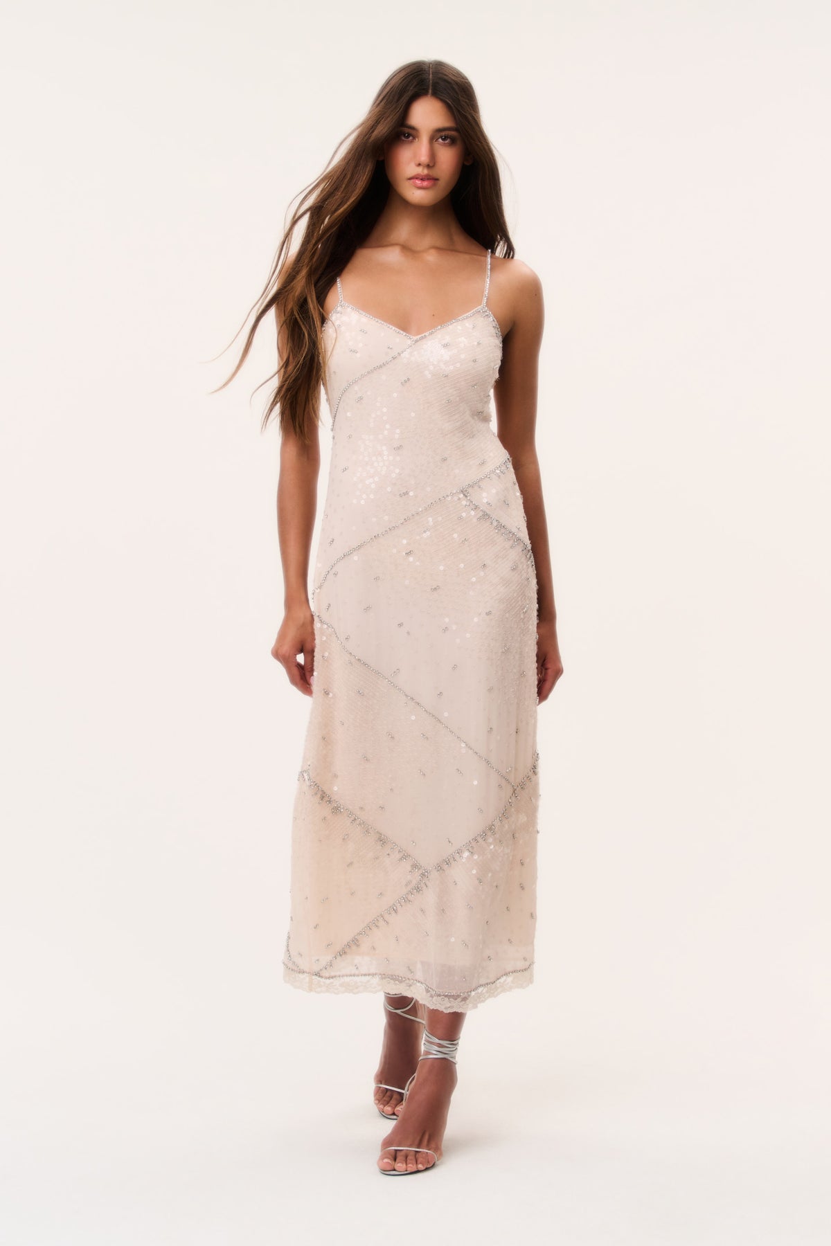 Sequin maxi dress in light peach with spaghetti straps and V-neck, full length