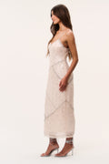 Sequin maxi dress with spaghetti straps and V-neck, side view in light peach