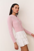 Fitted pink cashmere cardigan, button-front, long sleeves, cropped side view