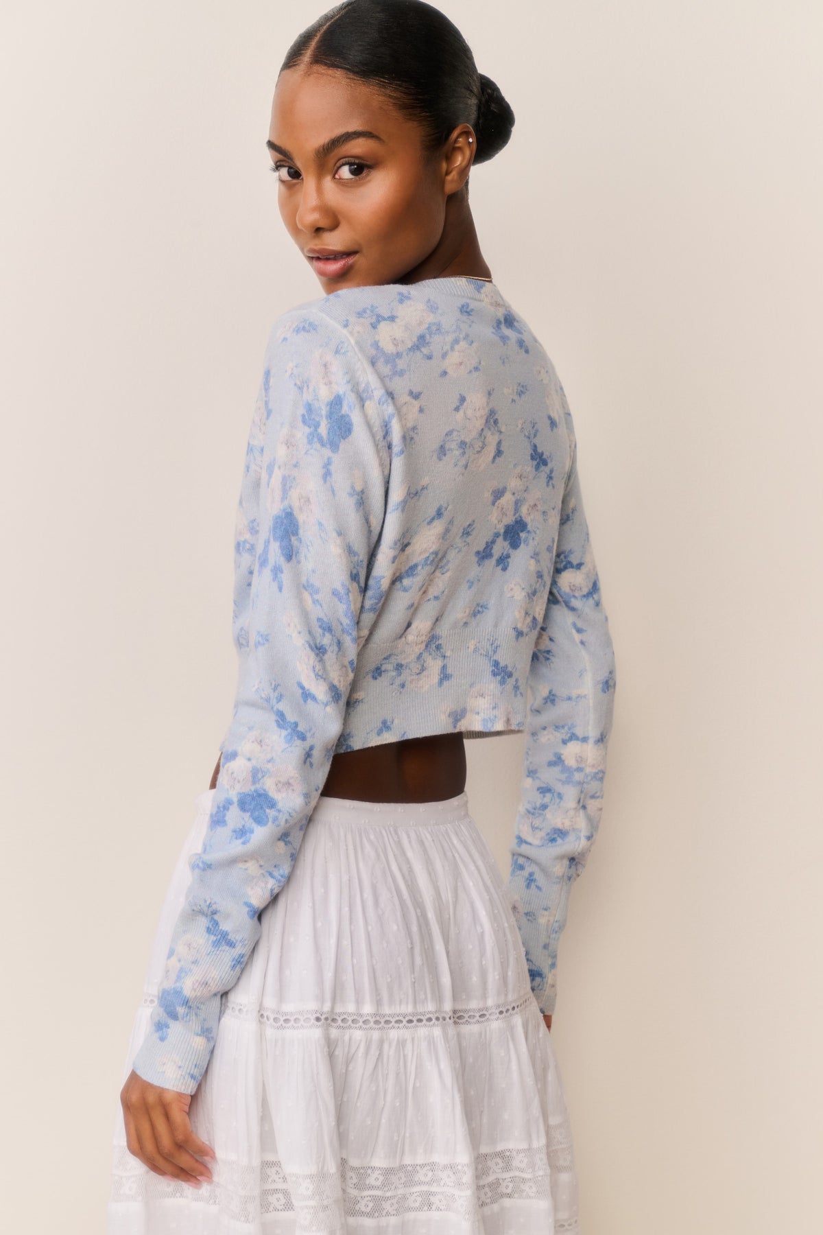 Floral print cotton cardigan in pale blue, long sleeves, back view with cropped hem