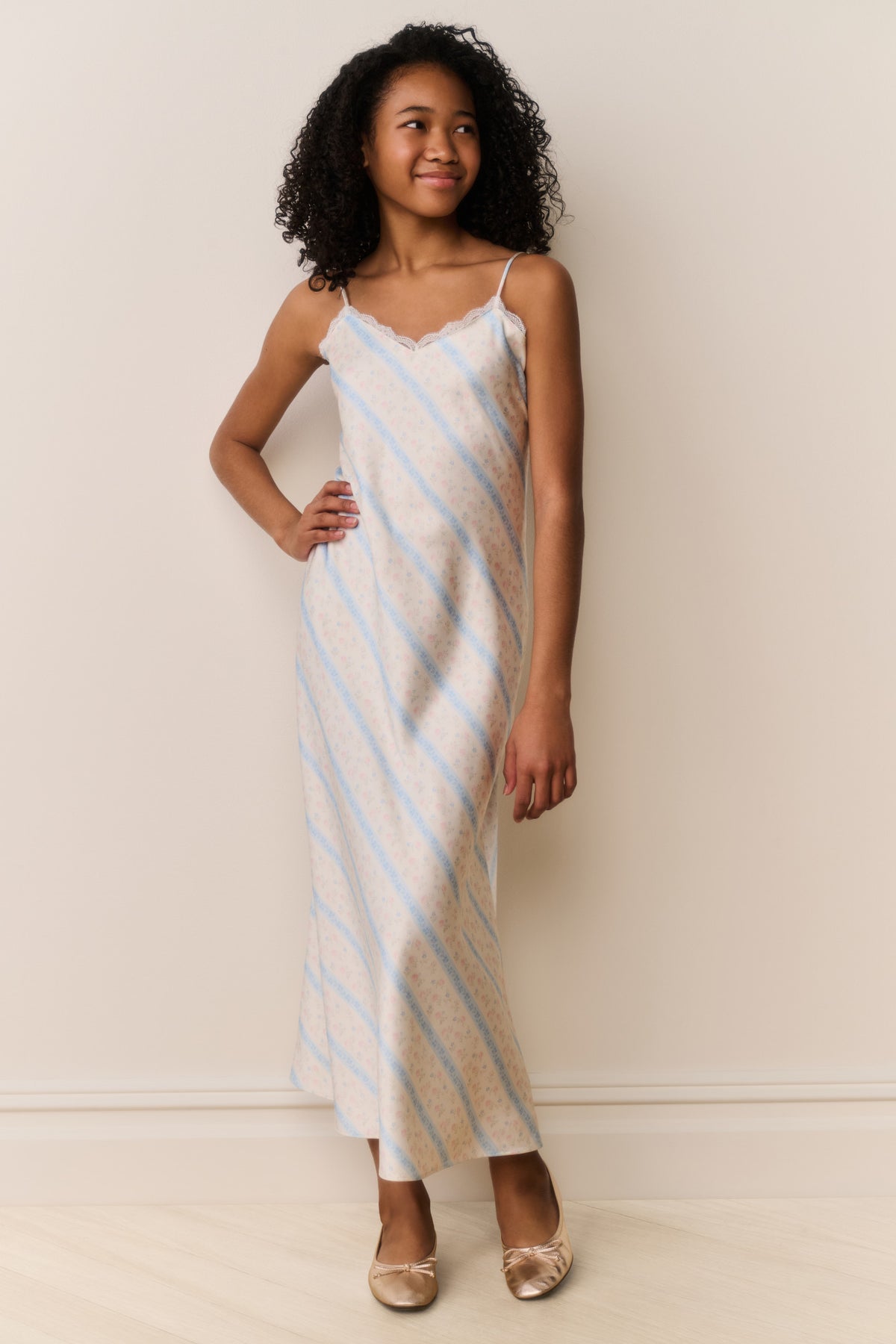 Light blue and white striped sleeveless maxi dress with thin spaghetti straps and straight hem