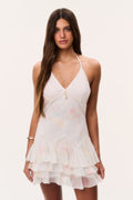 White mini silk chiffon halter dress with pastel print and tiered ruffle skirt