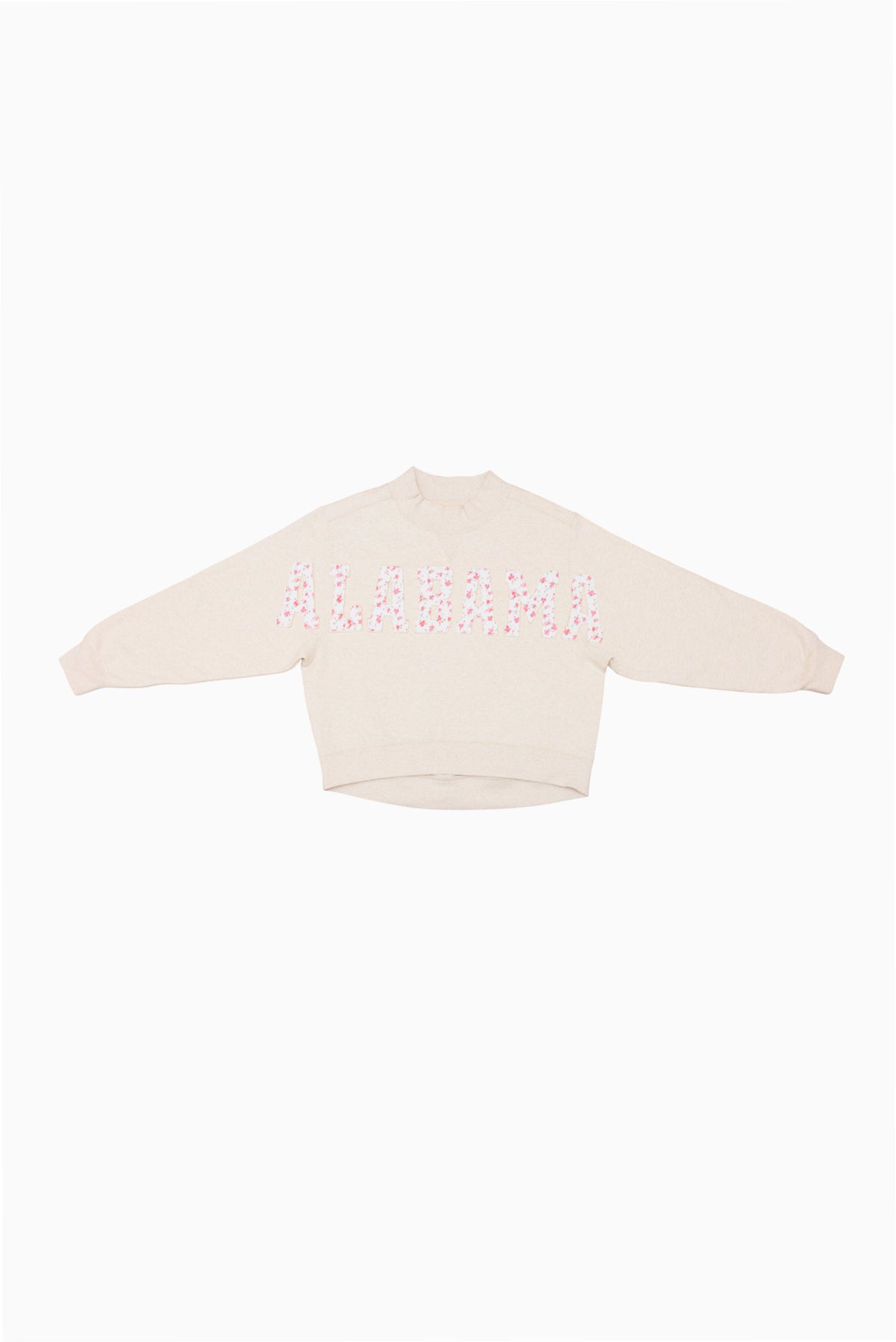 Cream mockneck crew sweatshirt with pink dotted graphic across the upper back