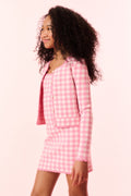 Pink checkered knit jacket, long sleeves and button front, side view