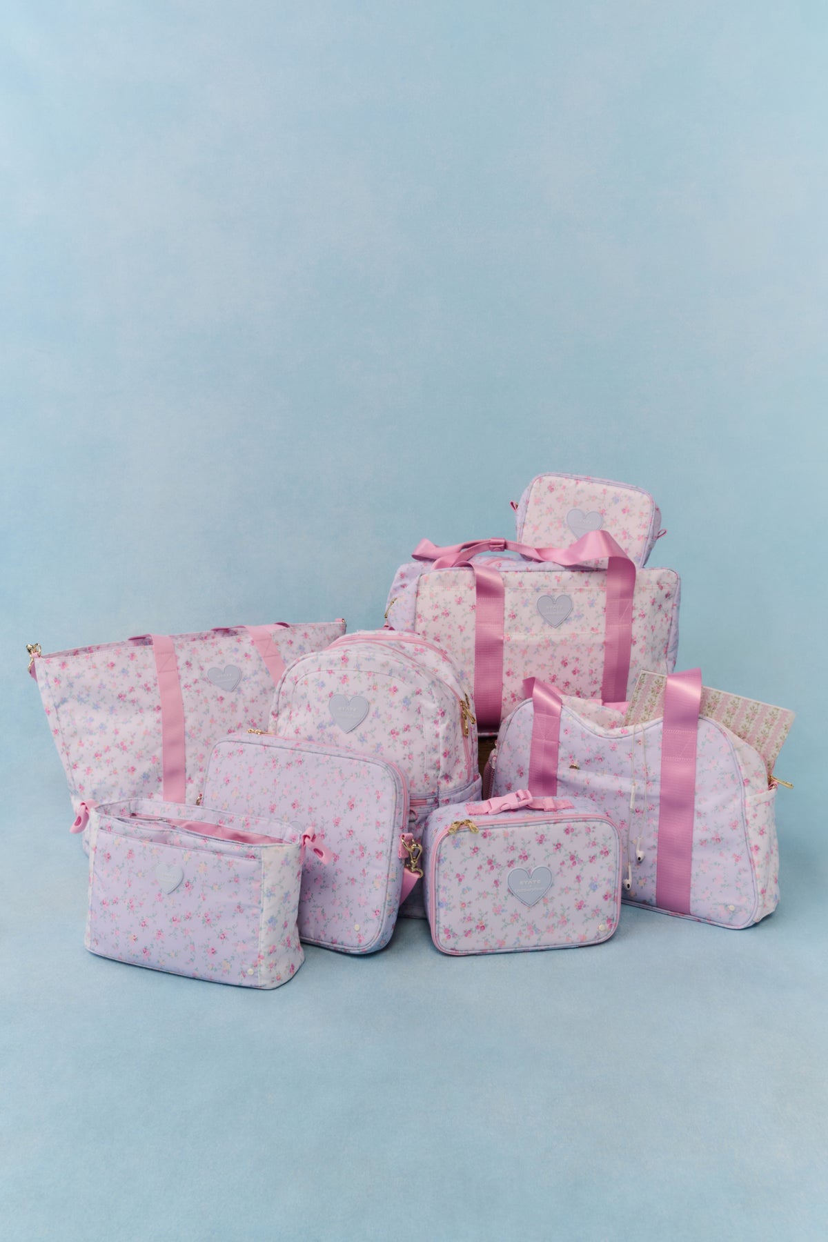 Set of floral diaper tote accessories: large bag, small pouches, and matching organizer