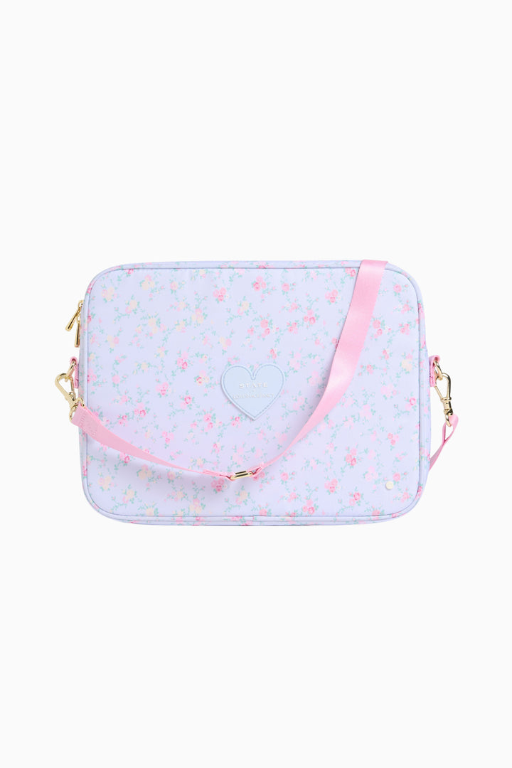 Floral laptop case with heart emblem, pink trim, gold-tone hardware, zip closure