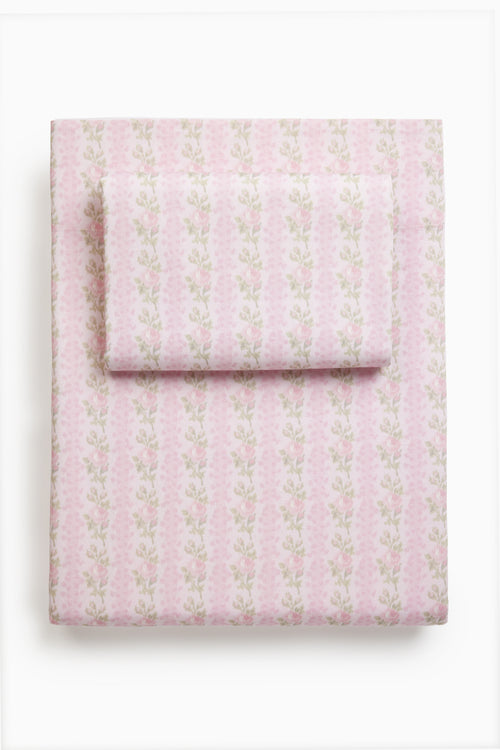 Pink printed sheet set with small allover pattern, folded stack