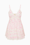 White floral mini dress with spaghetti straps and tiered ruffle hem, pink pattern