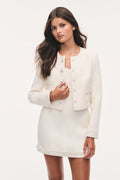 Tween tweed jacket in light ivory, close-up of front buttons and pocket flap