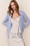 Light blue cashmere cardigan with V-neck, button front, and long sleeves