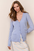 Light blue cashmere cardigan with V-neck, buttons, and patch pockets