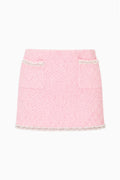 Pink knit tweed mini skirt with contrast trim and straight mini hem
