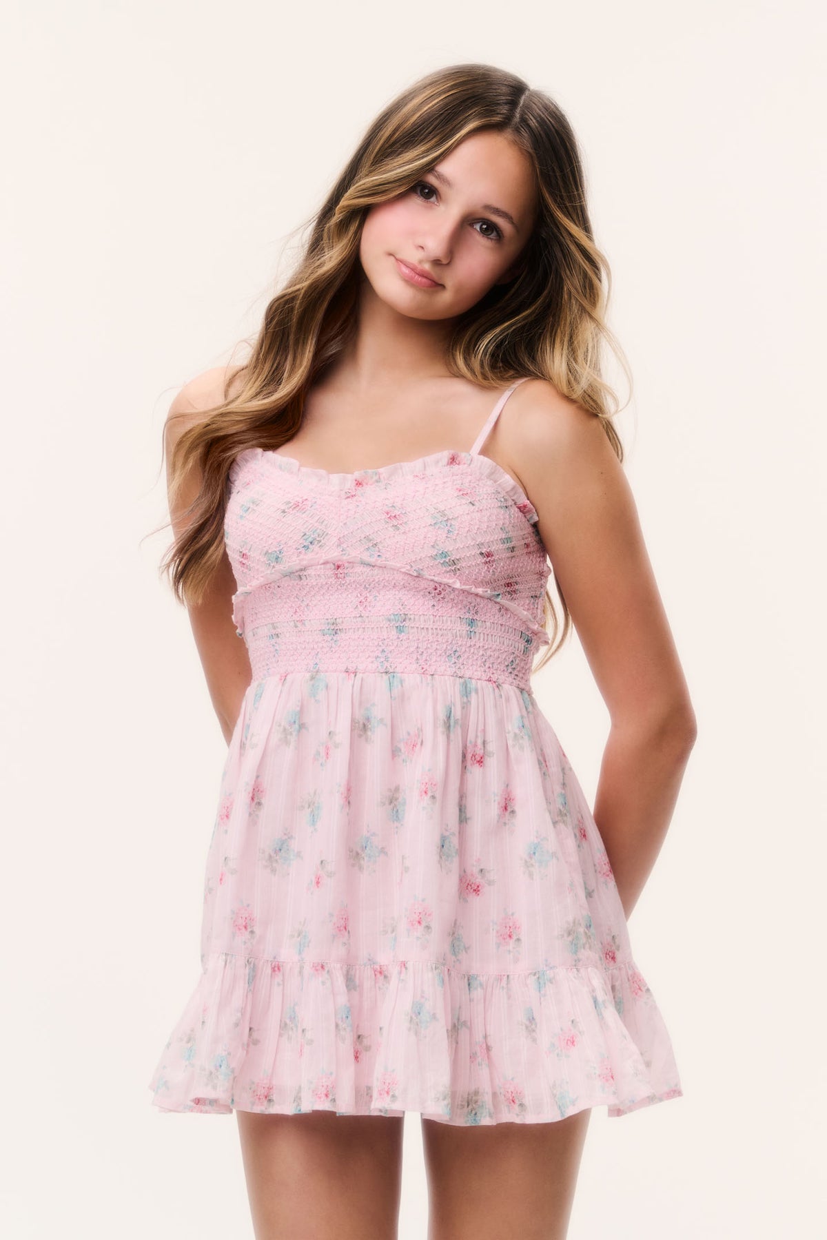 Tween pink floral tiered dress with spaghetti straps and smocked bodice