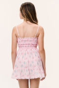 Tween pink floral tiered dress back view with spaghetti straps and smocked bodice