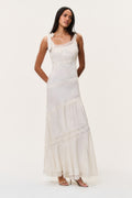 Ivory asymmetrical tiered maxi dress with lace-trimmed bodice and fitted waist