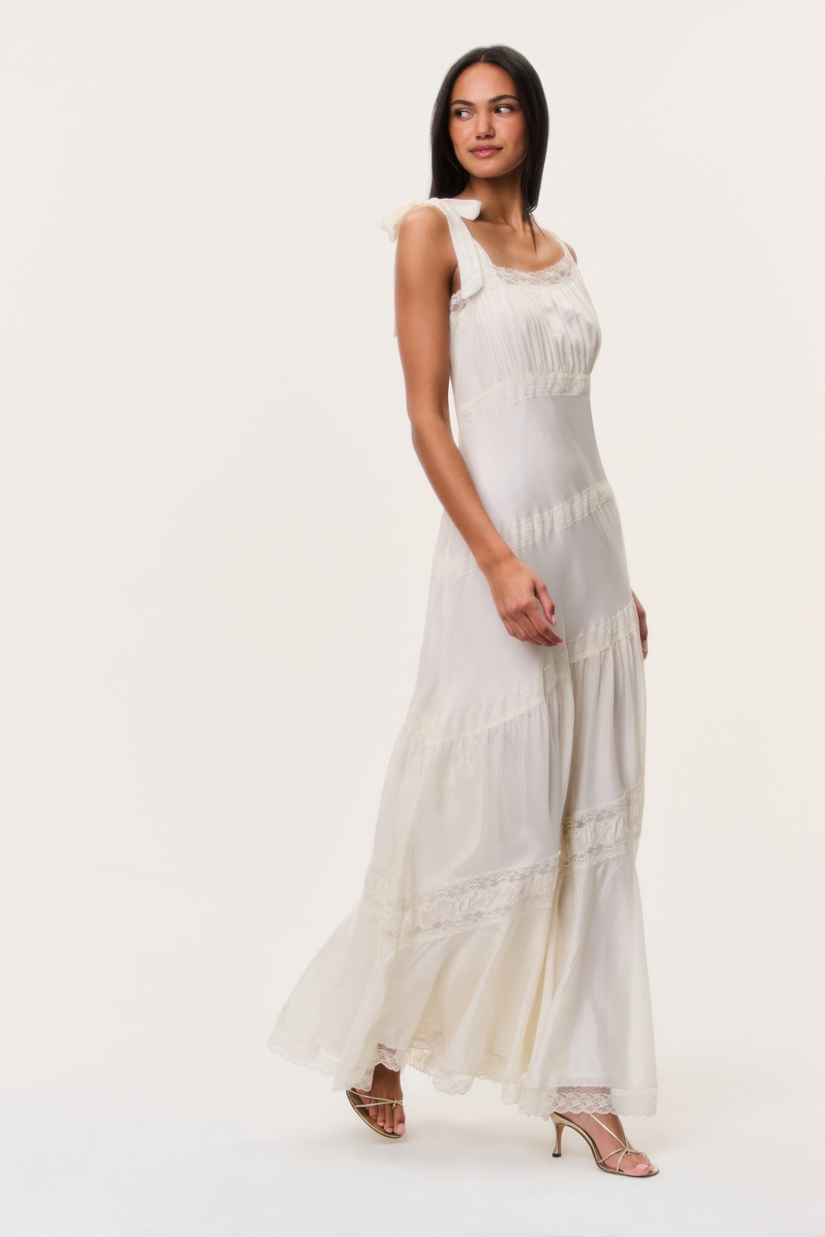 Ivory asymmetrical maxi dress with sleeveless lace yoke and flowing tiered hem