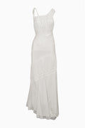 Ivory asymmetrical maxi dress front view with lace yoke and tiered, sheer skirt