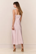 Blush satin midi dress with thin straps, side view, and embroidered neckline trim
