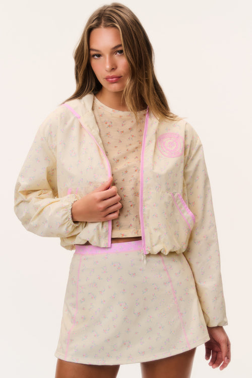 Cream windbreaker hoodie with pink zipper and hood, front view