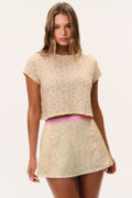 Cream ditsy floral cropped tee with short sleeves and crew neckline
