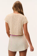 Cream ditsy floral cropped tee shown from the back, short sleeves