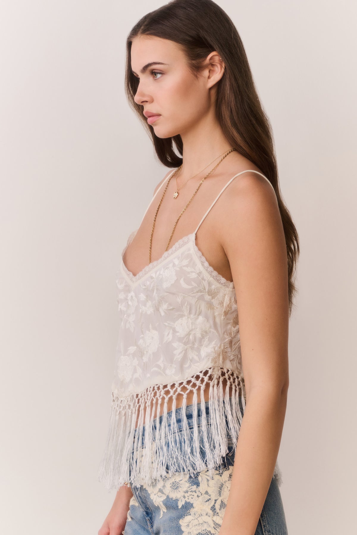 Ivory lace fringe crop top with spaghetti straps, V-neck, tasseled hem