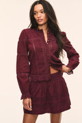 Burgundy cotton Swiss dot top with button placket and lace-trim hem