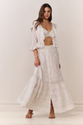 White maxi skirt with button front, tiered ruffle hem, embroidered texture
