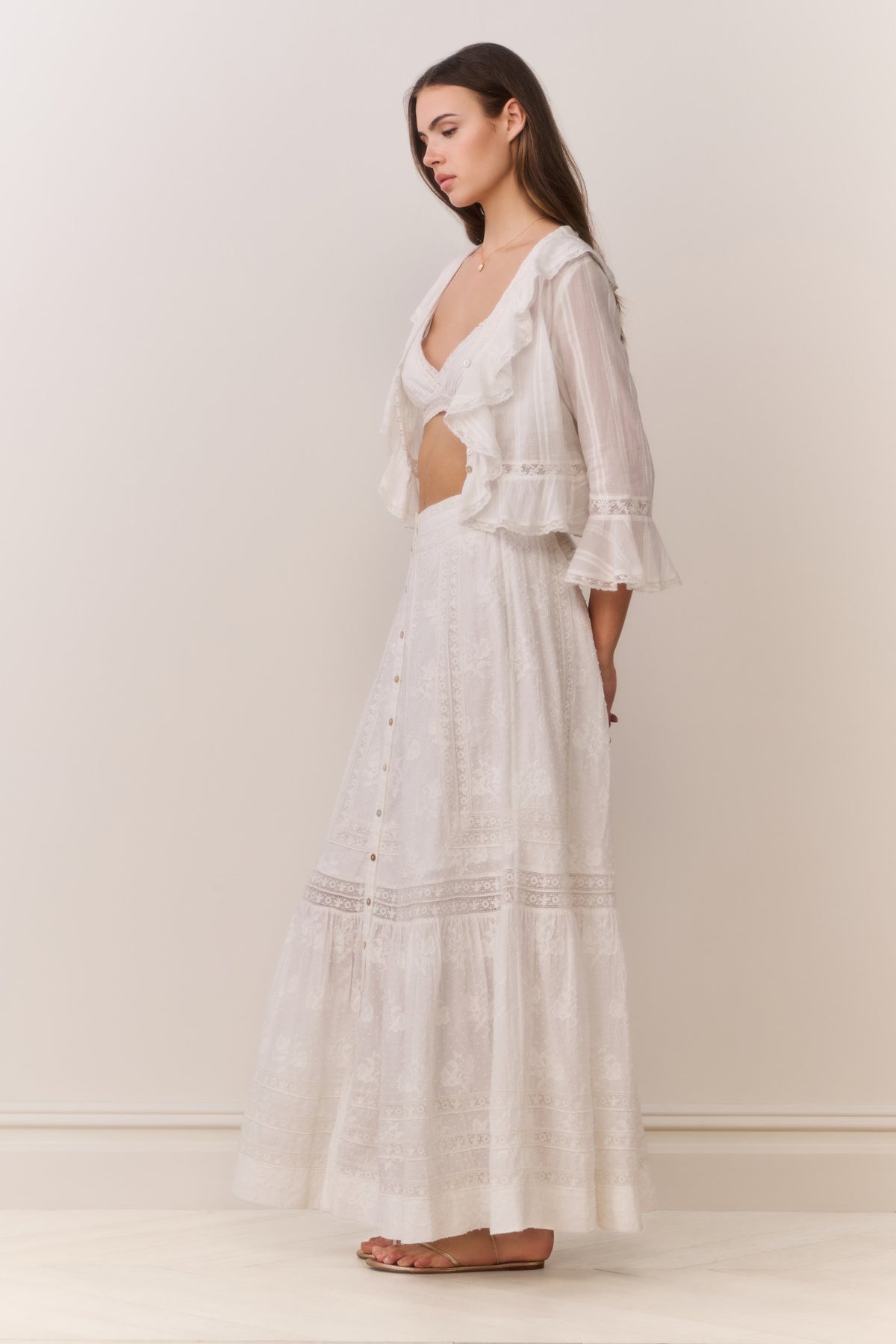 White cotton maxi skirt with button front and tiered embroidered ruffle hem