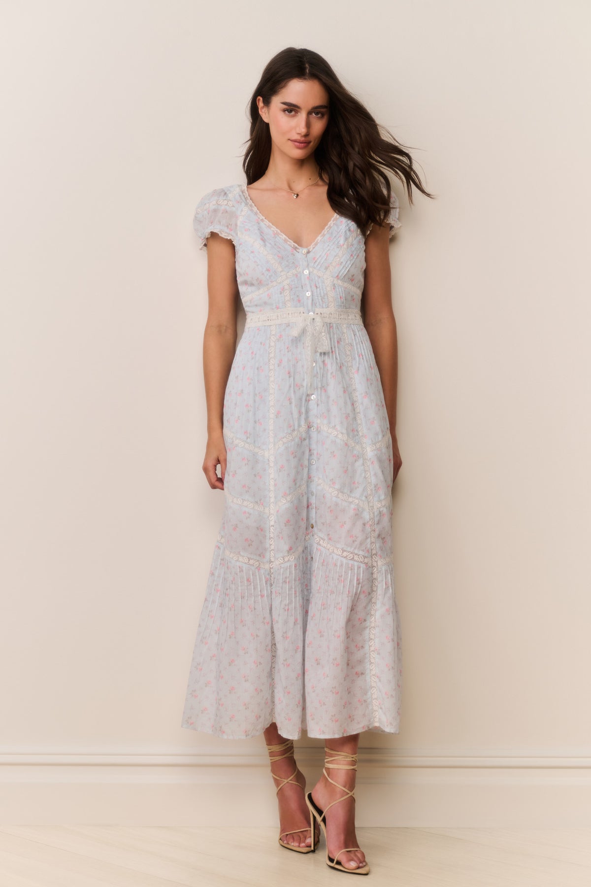 Floral cotton midi dress with puff sleeves, V-neck, and button front; tiered skirt