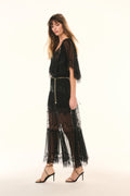 Black lace pleated maxi skirt with sheer tiers, side view and lace-trim hem