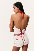 Back view crochet halter top with open back and red ribbon tie straps