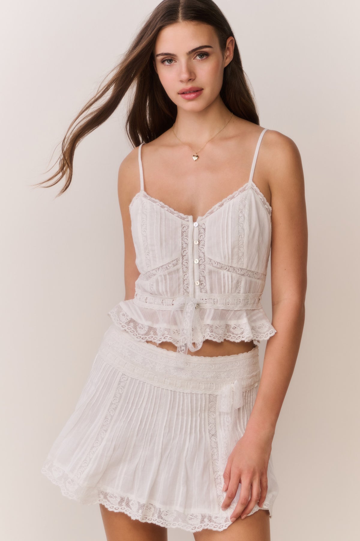 White cotton Victorian top with corset front buttons and lace-trim peplum hem