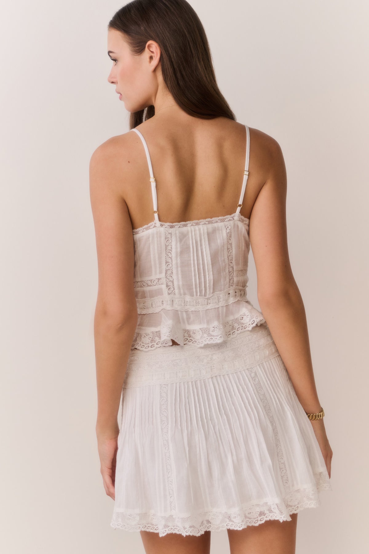 White cotton Victorian top, lace-trimmed back with spaghetti straps and ruffled hem