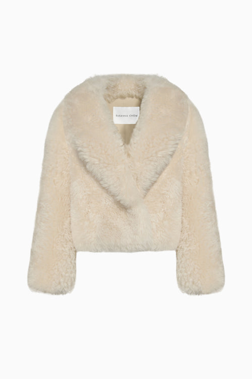 Cream shearling coat with open V neckline and long sleeves