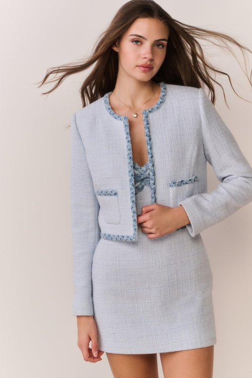 Light blue tweed jacket with denim-trimmed placket and patch pockets