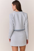 Light blue tweed jacket, back view with denim-trim hem detail