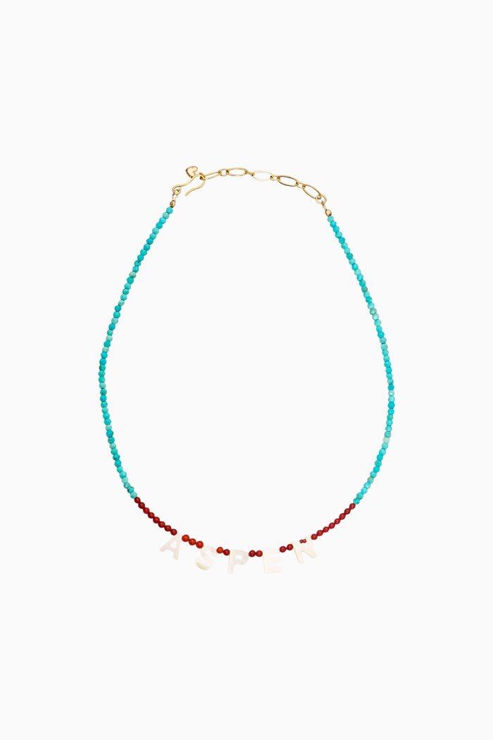 Gold-tone teardrop beaded necklace with turquoise and red accents