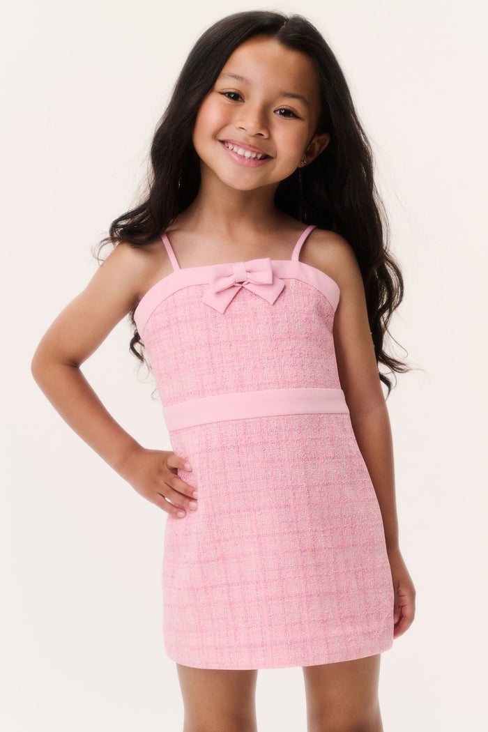 Pink tweed sleeveless dress with bow front and spaghetti straps