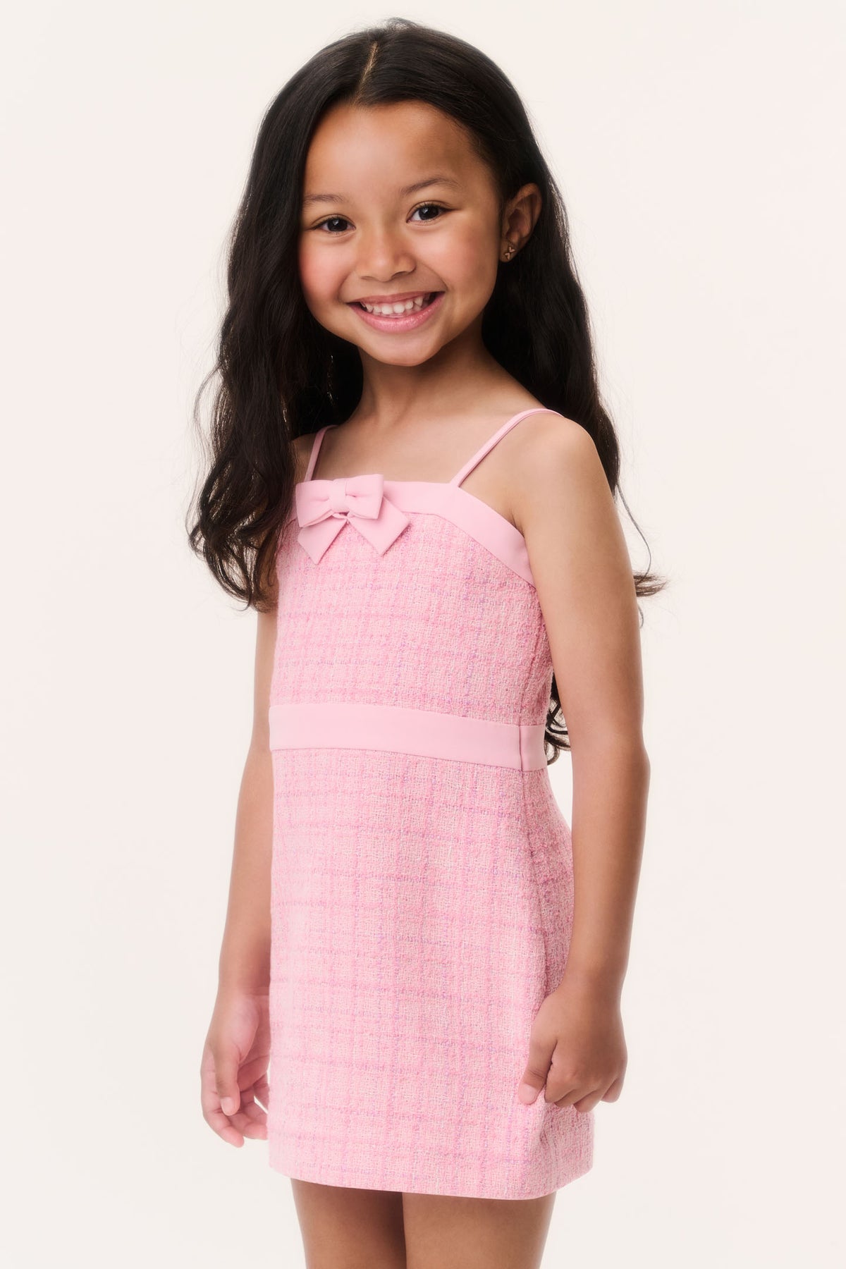 Pink tweed sleeveless dress with bow front and spaghetti straps
