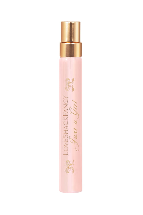 Single pink perfume travel spray bottle with gold mist sprayer, gold-tone top.