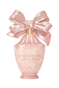 Pink bow perfume bottle with ornate gold label and LoveShackFancy style writing