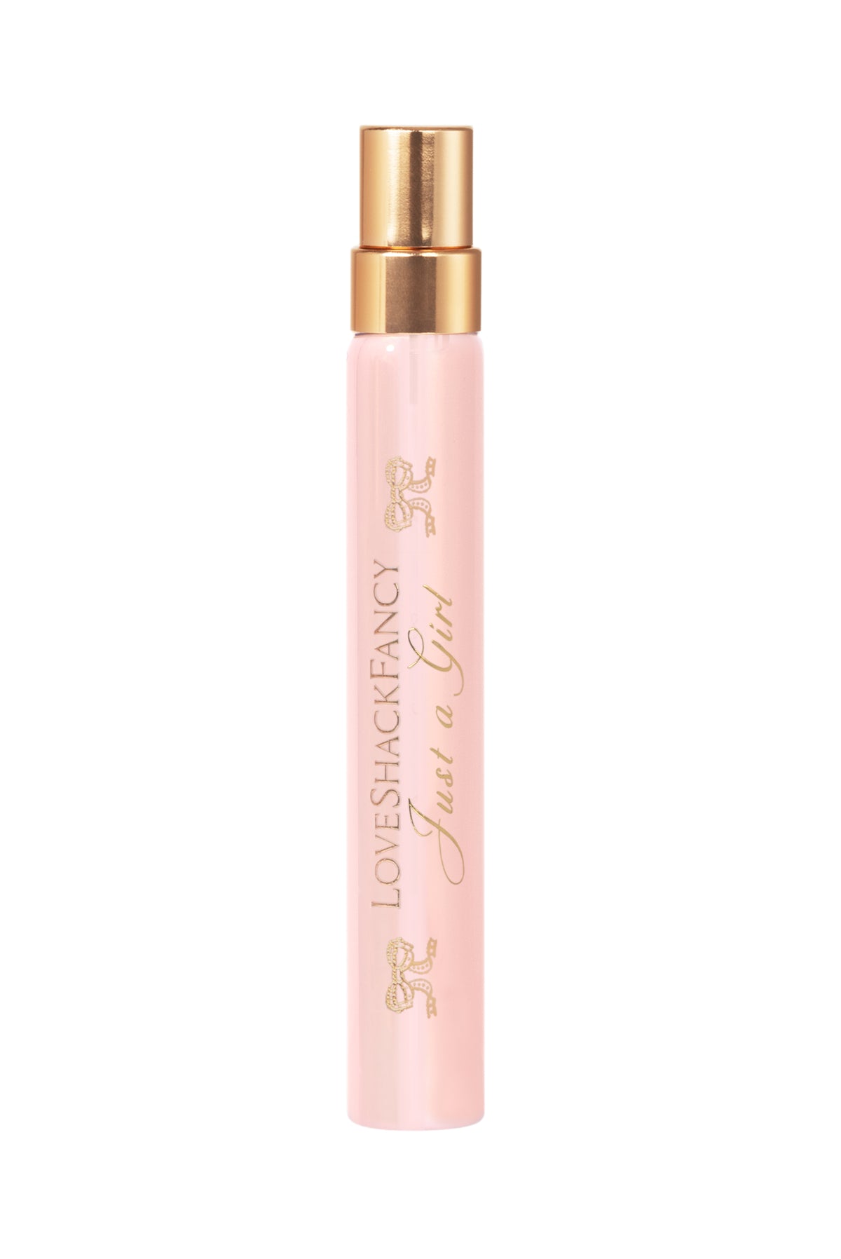 Pink travel perfume spray bottle with gold top and LoveShackFancy logo