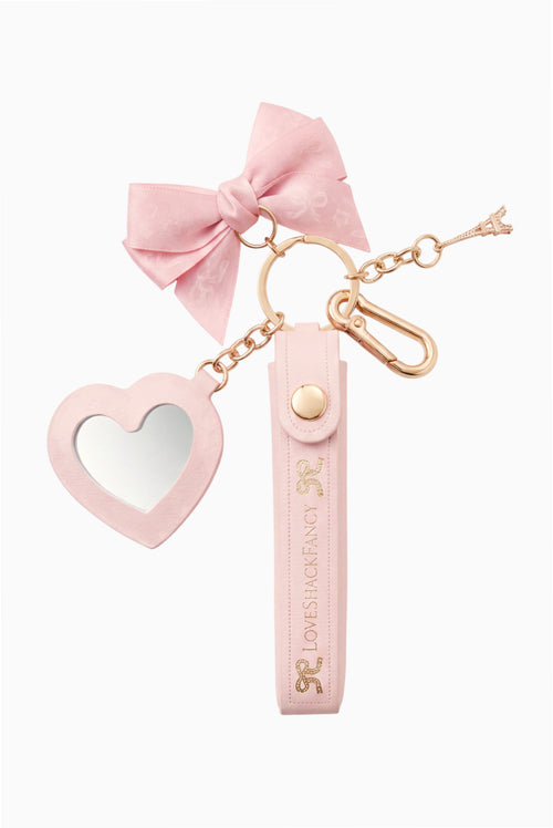 Pink bow keychain with heart charm and small fragrance vial
