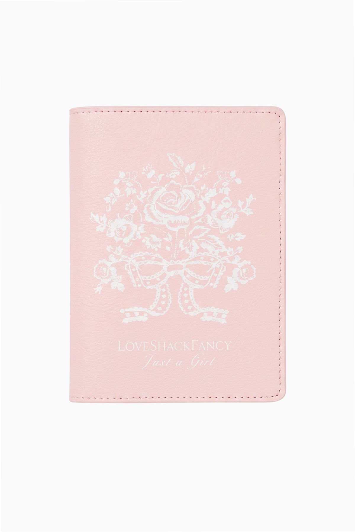 Blush pink travel case cover with embroidered crest graphic and dotted border